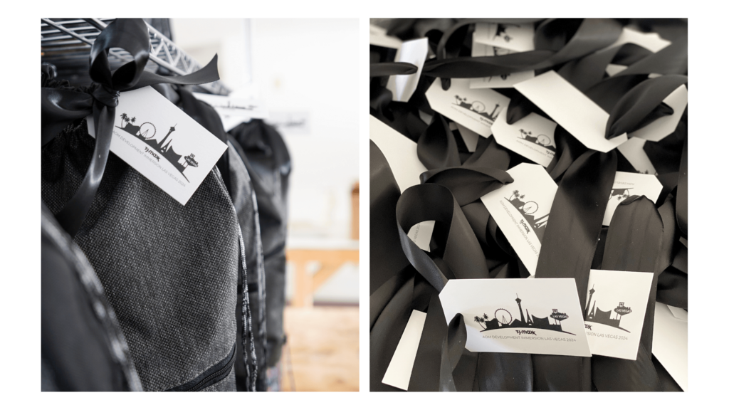 Conference attendee gifts on a welcome table, featuring custom-branded tote bags and notebooks