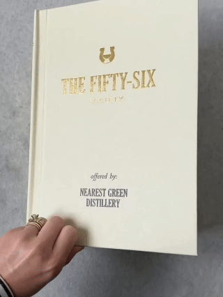 The Fifty-Six Society box, one of Nearest Green Distillery's premium corporate gifts, designed as a gold-foil cloth-bound book